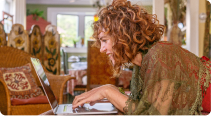 caren jacobs on her computer mobile